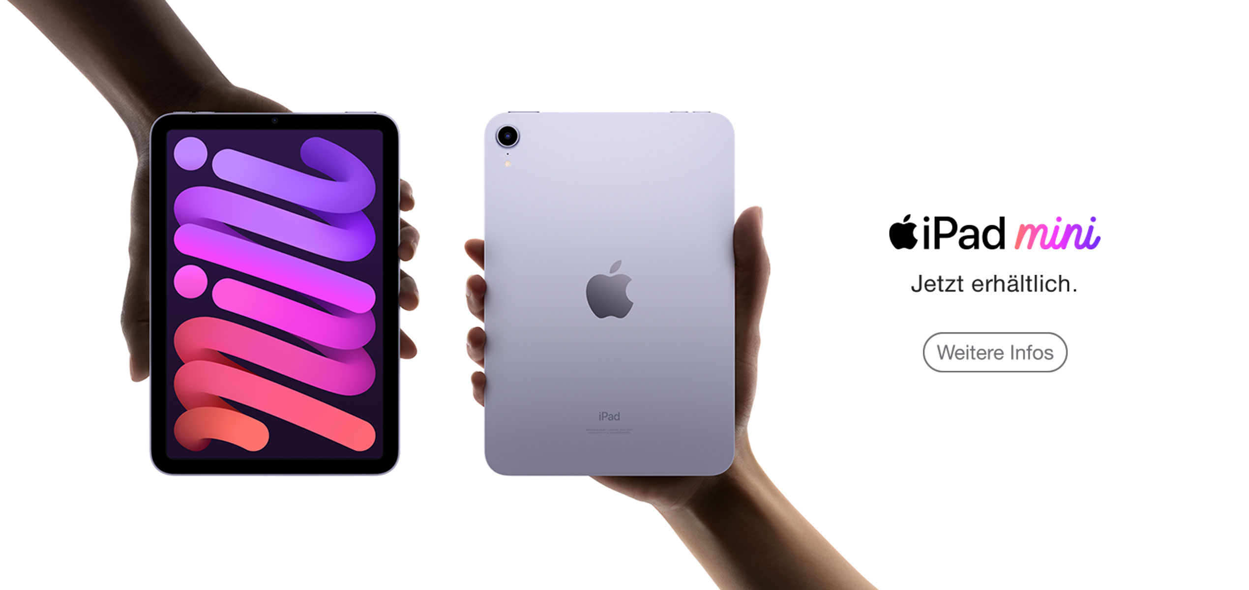 Zwei Hände halten zwei iPad mini in violett